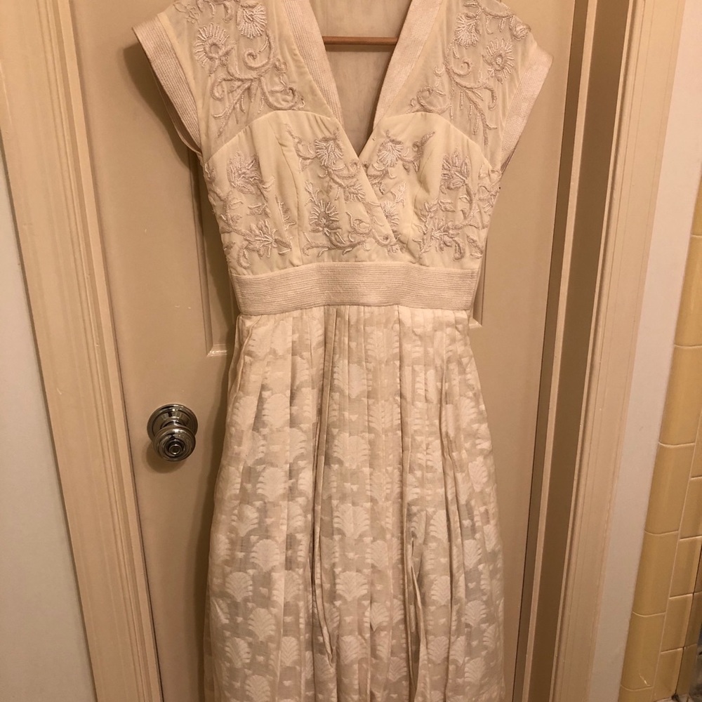 ivory A line cocktail dress. Cotton and silk blend. Tulle underskirt